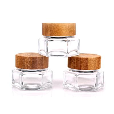 China 100ml cream bottle, glass cosmetic bottle, polygonal glass bottle with bamboo lid for sale