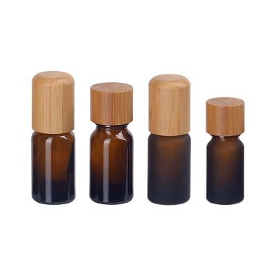 China 10ml amber glass essential oil bottle frosted amber brown glass bottle with 18mm bamboo wooden screw cap for essential o for sale