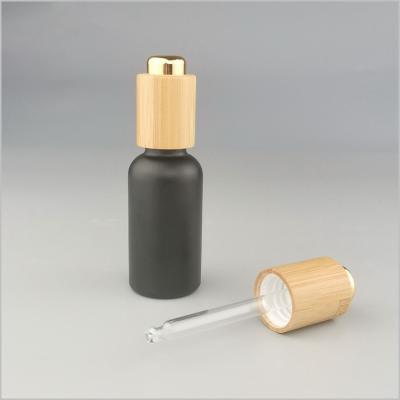 China Ceramic Brown Tea Color Essential Oil Bottle Press Dropper Serum, Bamboo Wood Dropper Cap for sale