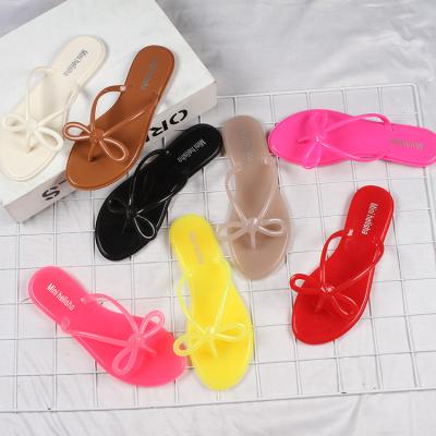 China CUSHIONING Outdoor Slippers Jelly Slides Ladies Designers Slide Summer Beach Slippers Women's Jelly Shoes Red Flip Flops TX0719-03 With Bow for sale