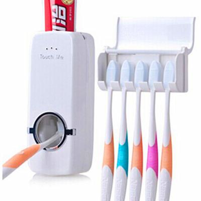 China Viable Factory Wholesale Toothbrush Holder and Toothpaste Dispenser Bathroom Toothpaste Squeezer Vending Machine for sale