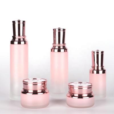 China Wholesale Price Glass Water Bottles Lotion Bottle Skin Care Set Bottle Elegant Pink Cosmetics Luxury With Cap for sale