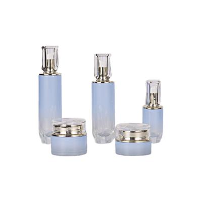 China Custom Face Care Cosmetic Pump Bottle Glass Emulsion Container China Blue Glass Packaging Cosmetic Bottles Skin Care Pump Bottle for sale