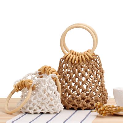 China Bohemian Fashionable Mini Clutch Tote Beach Bag with Small Handle Weave Handbags Summer Round Beach Vacation Handbag for sale