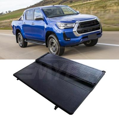 China Waterproof Custom Accessories Pickup Hard Folding Quadruple 5ft Tonneau Bedspread For Toyota Vigo Tacoma Tundra for sale