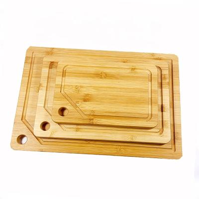 China Sustainable Hot Selling High Quality Eco-Friendly Bamboo Cutting Board with Juice Slot for sale