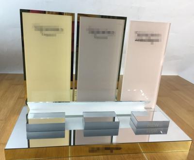 China Cosmetic Display Luxury Gold And Silver Mirror Acrylic Cosmetic Display Stand for sale