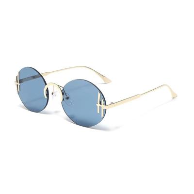 China Rilmess 2022 New Frame Summer Fashion Personality Women Round Rimless Sunglasses Men for sale