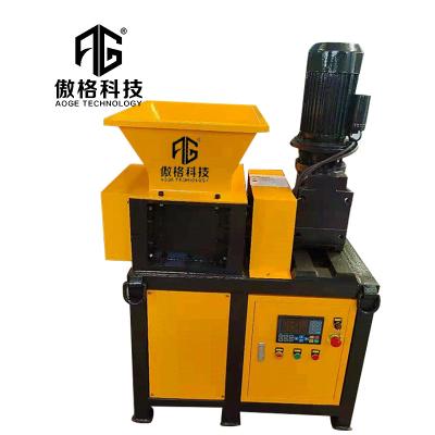 China Hotels Professional Waste Paper Wood Plastic Cloth Tyre Metal Industrial Double / Single Shaft Mini Shredder Machine for sale