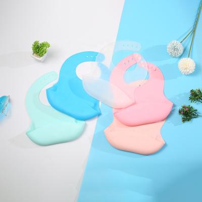 China BPA Free Soft Adjustable Fit Waterproof Silicone Baby Bib With Food Catcher Baby Silicone Bib for sale