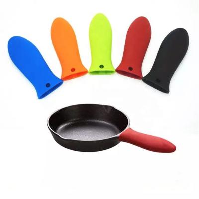 China Durable Heat Protective Silicone Handle For Hot Cast Iron Skillets Silicone Pot Handle Holder for sale