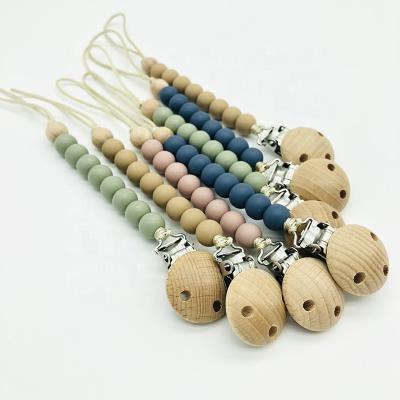 China BPA Free Wholesale Latest Design Wooden Silicone Beads Baby Pacifier Clips Baby Wooden Pacifier Chain for sale