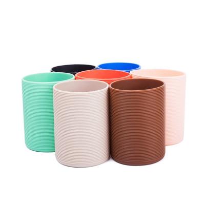 China Sustainable Heat Resistant Silicone Coffee Mug Sleeve With Custom Logo for sale