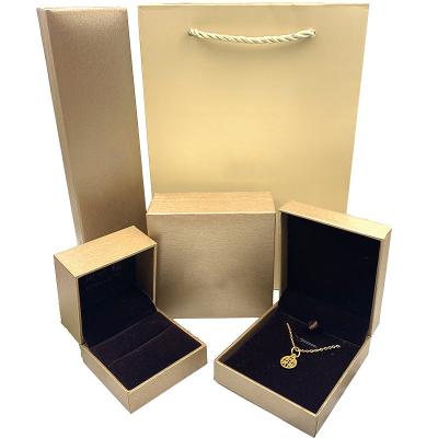 China Fashion Jewelry Store Trendy Jewelry Gold Box Packaging Gold Ring Necklace Bracelet Custom Packaging Box for sale