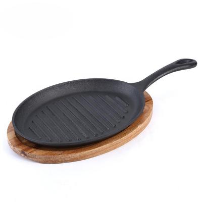 China Sustainable Place Cast Iron Frying Pan Grill Pan Non-Stick Coated Steak Skillet With Wooden Folding Tray for sale