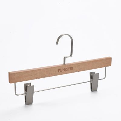 China Eco-friendly Material Beech Wood Clothes Pants Hanger With Clips Edges Hanger For Display for sale