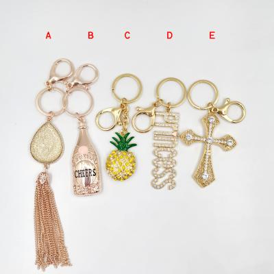 China Hot Pineapple Zinc Alloy Gold Plated Crystal Cross Tassel Crystal Cross Tassel Letter Princess Bottle Wine Jewelry 14K Enamel 14K Key Chain Promotion Gift Sale Key Chain for sale