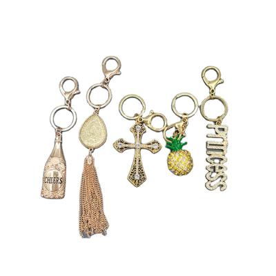 China Custom Cross Crystal Stain Crown Letter Enamel Pineapple Tassel Bottle Jewelry Promotion Gift Design Gift Design Key Chain Fast Delivery for sale