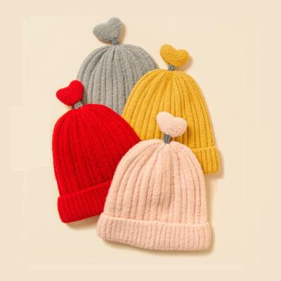 China COMMON Custom Embroidery Patch Logo Warm Winter Hat Knitted Hat Kid Size Slapped Beanie Kids Rolled Beanies for sale