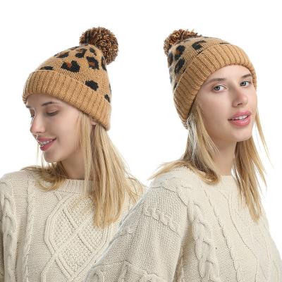 China YOUNGER COMMON Winter Warm Sale Pompom Hat Women Leopard Jacquard Knit Women Pom Beanie Warm Knitted Hats For for sale