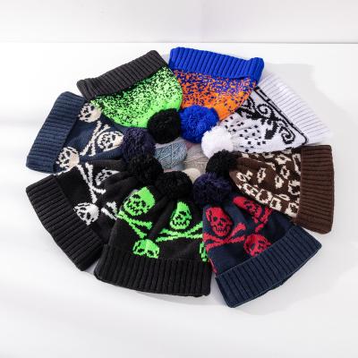 China Image factory wholesale price jacquard ball skull beanie hat winter knitted beanies for sale