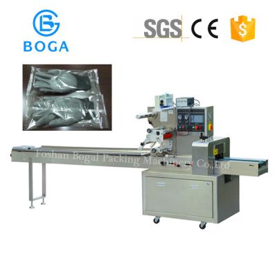 China Multi Function Pillow Packing Machine Surgical Glove Packing Meat Wrapping for sale