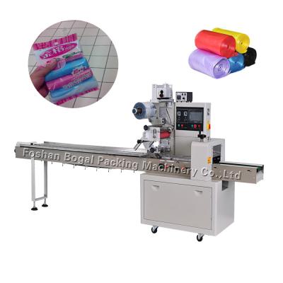 China Plastic Waste Bag Horizontal Flow Pack Machine Garbage Bag Roll Packaging for sale