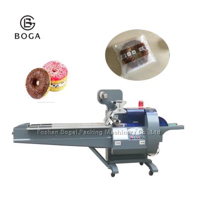 China OEM factory price food application small doughnuts cakes packing machine looking for dealer in Malaysia for sale