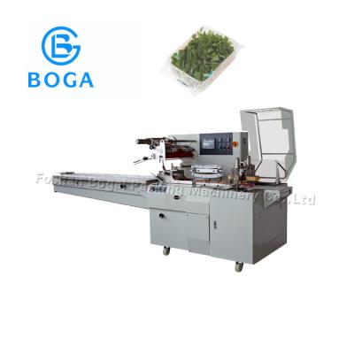 China Herbs Horizontal Flow Wrap Packing Machine Box Motion Yellow Machine Body for sale