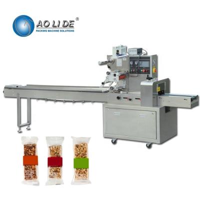 China Chikki Horizontal Flow Wrap Packing Machine Automatic For Food Granola Cereal Bar for sale