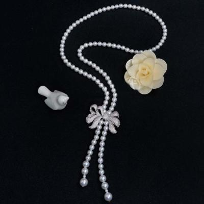 China Women White 8mm Shell Pearl Starnds Tassel Necklace with Cubic Zirconia Bow Charm (SN702141) for sale