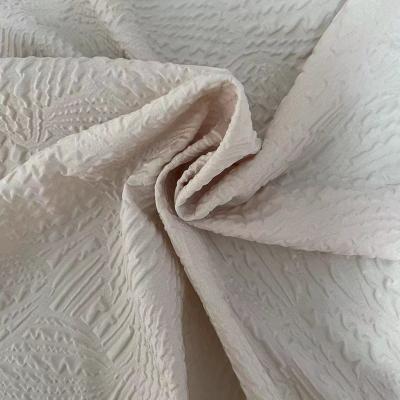 China Waterproof Home Textile Material 100% Polyester Dyed 3D Microfiber Design Embossed Bed Quilt Fabric for sale