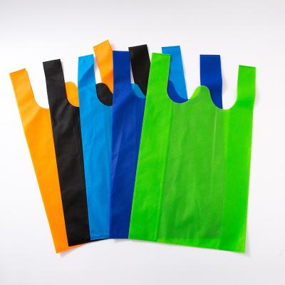 China Eco Carry Out Bags Retail Supermarket Handled Nonwoven Grocery Vest Bags With Handle Food Packaging for sale