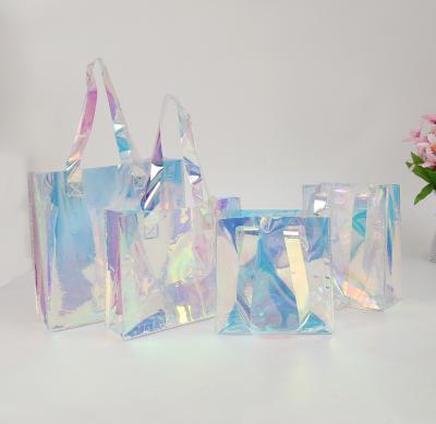 China New Fashion Moisture Proof Ready To Ship Clear Transparent Shiny PVC Makeup Bag For Lady Travel Laser Tote PVC Holographic Bag for sale