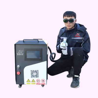 China Metal Surface Cleaning Regular Handheld High Fiber 1000W Laser Machine Metal Rust Removal Laser Cleaning Exterior Cleaning for sale