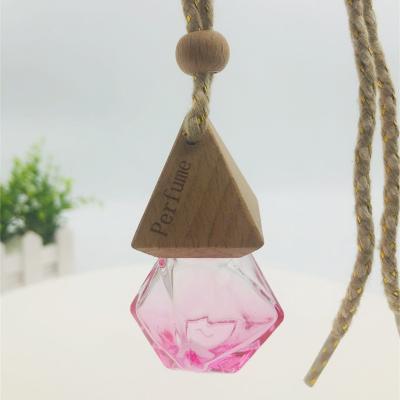 China Wholesale Luxury Hanging Cool Car Empty Clear Air Aromatherapy Bottle Glass Diffuser Essential Oil Perfume Bottle Packaging Liquid Glass Bottle for sale