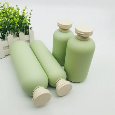 China Cosmetic In Stock Bottle Flip Cap Shampoo Bottle Pump Matte Green HDPE Squeeze 200ml 250ml 400ml 750ml for sale