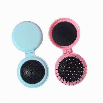 China New Product Hd Mirror Innovative Mini Convenient Airbag Comb Travel Folding Mirror Plastic Massage Comb for sale