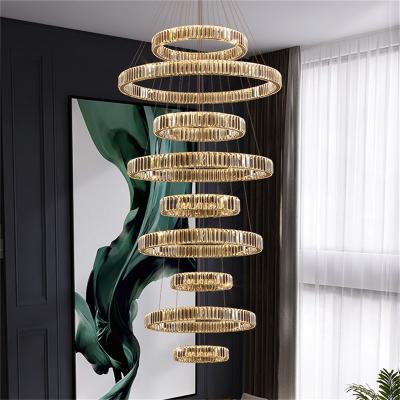 China Modern LED Large Round Luxury Gold Hanging Long Decorative Chandelier Fixtures Surround Pendant Lamp for sale