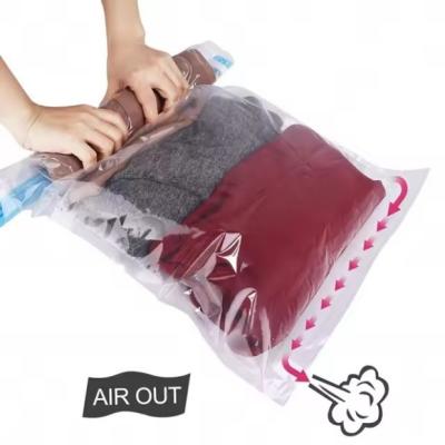 China Hand Pressing Travel Vacuum Storage Bag Roll Up Vacuum Space Bag for sale