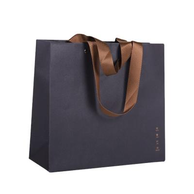 China Other Wholesale Custom Logo Apparel Shopping Bag Packaging Gift Wrapping Paper Bag With Rope Handle For Cosmetics for sale