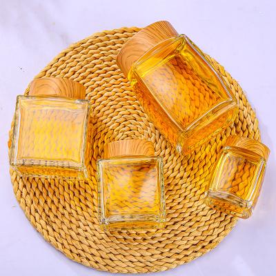 China Luxury quadrate food sealed jar 50ml 100ml 180oml 280ml 360ml 500ml 730ml honey jar storage glass jar for sale