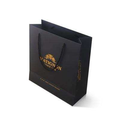 China Materials Gold Logo Small Black Craft Customized Recycled Paper Bag With PP Handle For Jewelry for sale