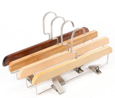 China Multifunctional Customized Logo Suit Wooden Pants Racks Skirt Rack Metal Clip Hanger for sale