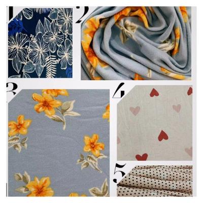 China Wholesale anti-static DTY with brush printing milk silk fabric stocklot fabric for women clothing stock fabric for sale