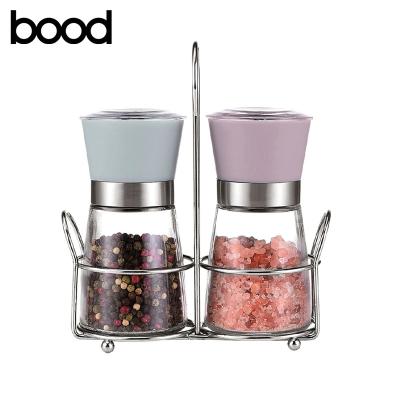 China Amazon Glass Bottle Salt and Pepper Mill Viable Hot Manual Grinder Set Promotion Cheap Price with Metal Stand for sale