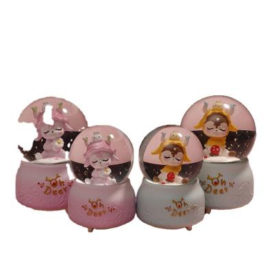 China Europe Resin Milu Senling Rotating Jet Snow Crystal Ball Music Box Deer Automatic Music Box Gift for sale