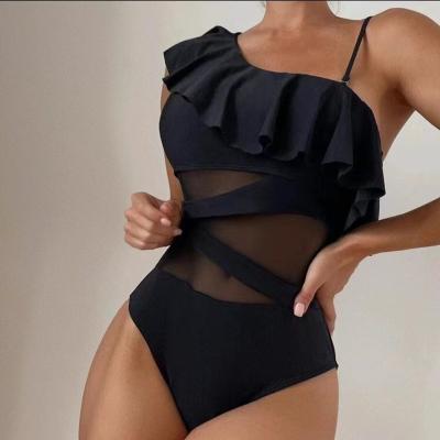 China 2023 New Design Cutout Mesh One Piece Bikini Beachwear Windproof Asymmetrical Swimsuit Women Sexy Black Slope Shoulder Ruffle Swimwear for sale