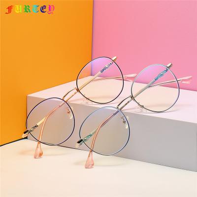 China Decorate New Oval Metal Frame 1970 Anti-Blue Light Glasses Fashion Trend Art Glass Frame for sale