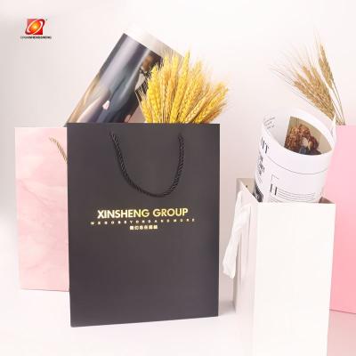 China Recycled Materials Professional Hand Cheap Recycled Kraft Paper Shopping Paper Bag for sale